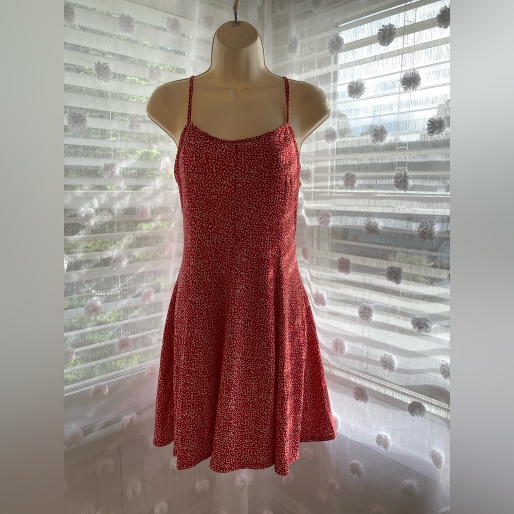 red flowy dress with flower print all over